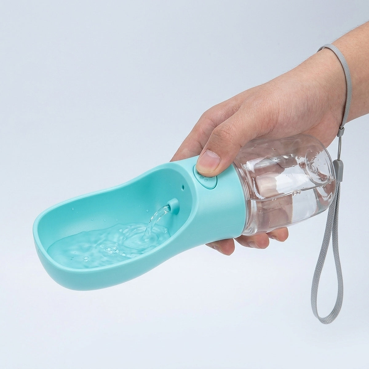 Pressing the paw button fills the fold-out drinking bowl with water